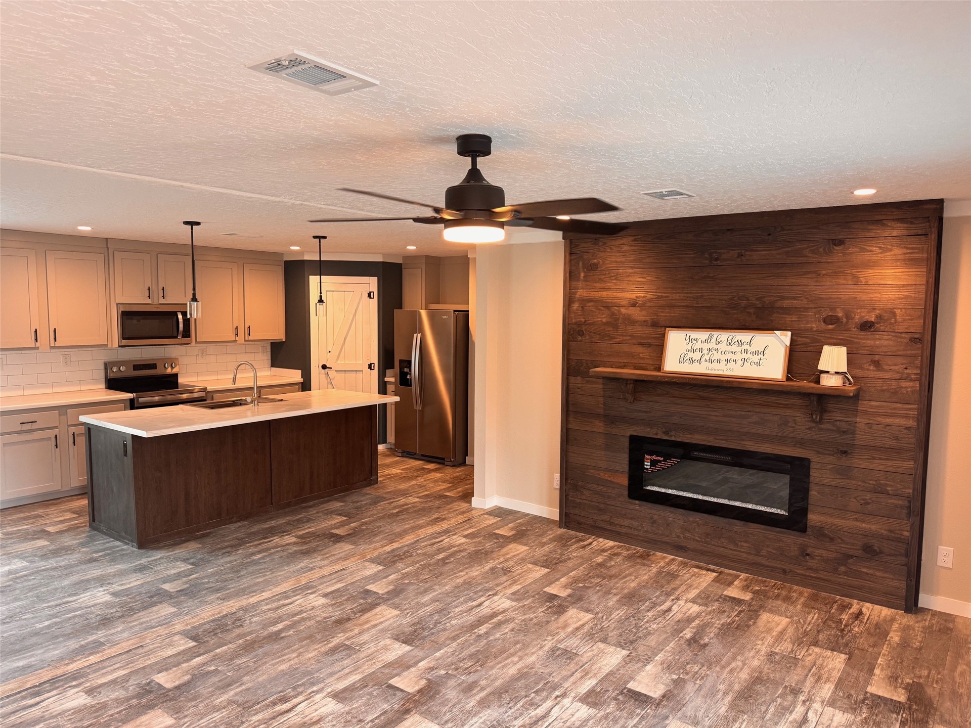 273535 Murrhee Road Hilliard, FL 32046 - Photo 8 of 25 a kitchen with a refrigerator and a stove top oven