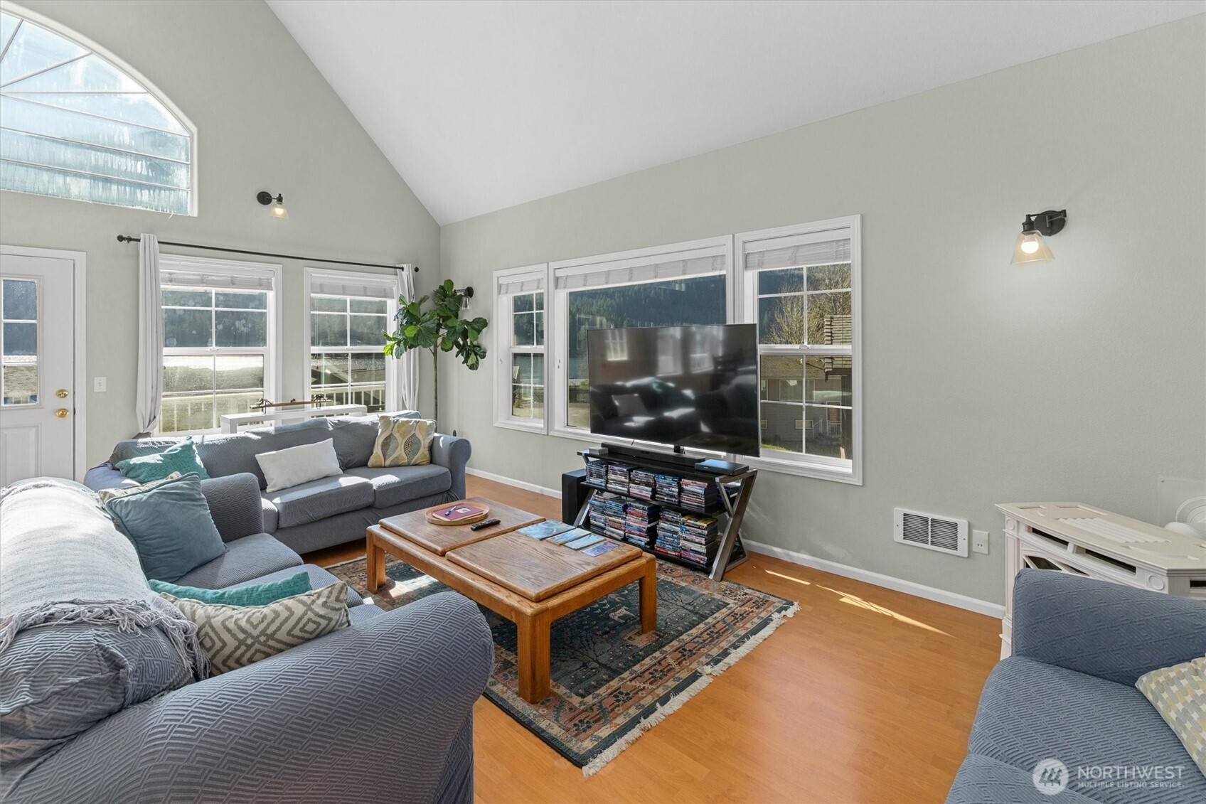 481 Maple Grove Road Port Angeles, WA 98363 - Photo 14 of 40 a living room with furniture a flat screen tv and a window