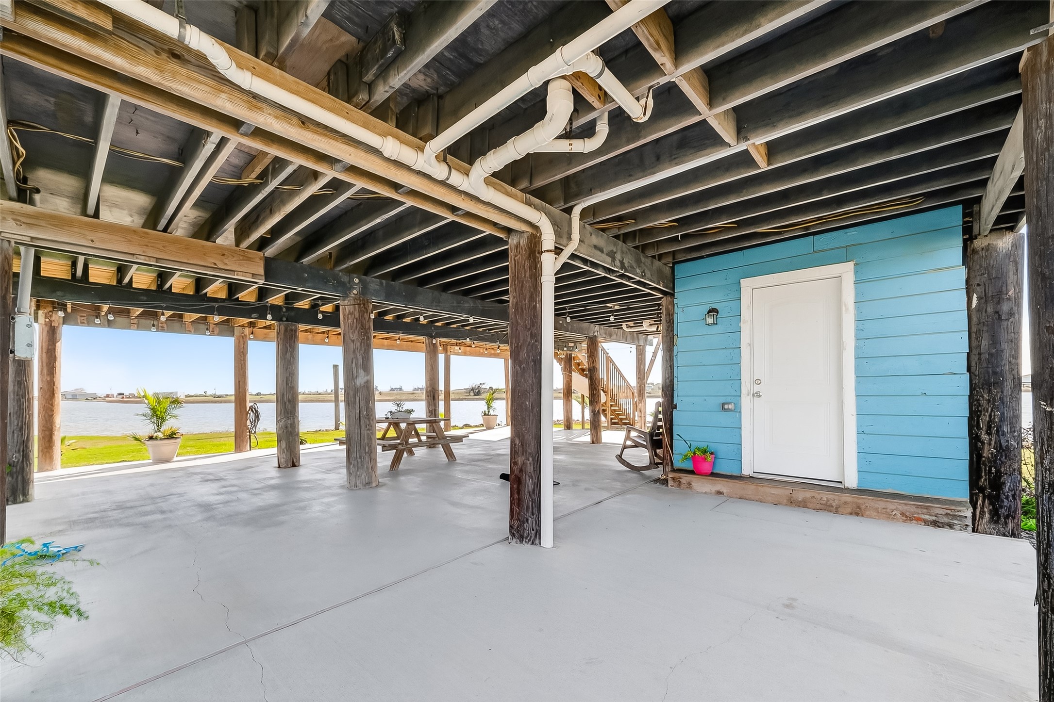 154 Poop Deck Lane Freeport, TX 77541 - Photo 25 of 32 First Floor covered Patio with 1/2 bath and outdoor shower overlooking water