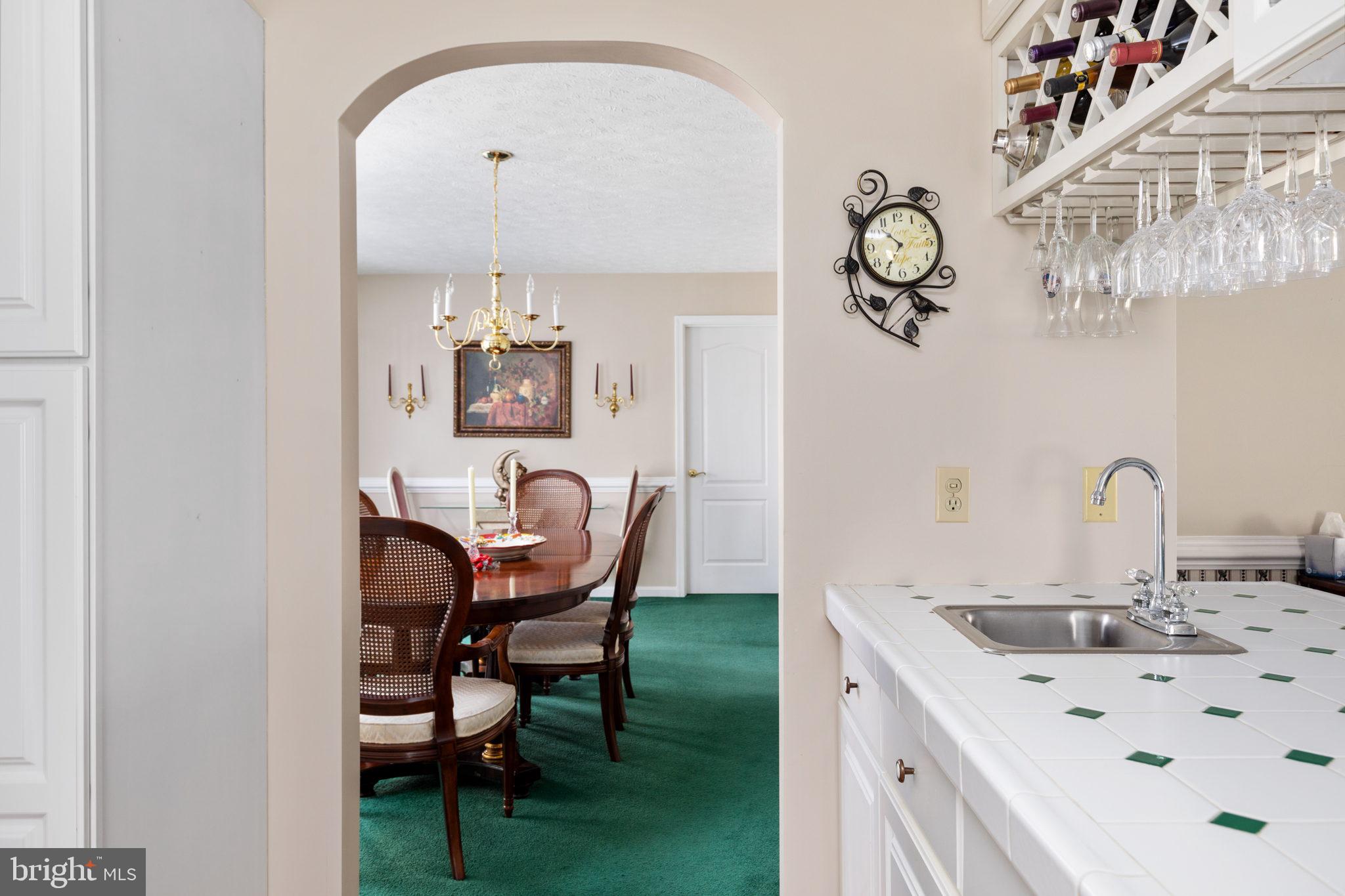 317 Anderson Road Basye, VA 22842 - Photo 12 of 51 a kitchen with a dining table chairs and chandelier