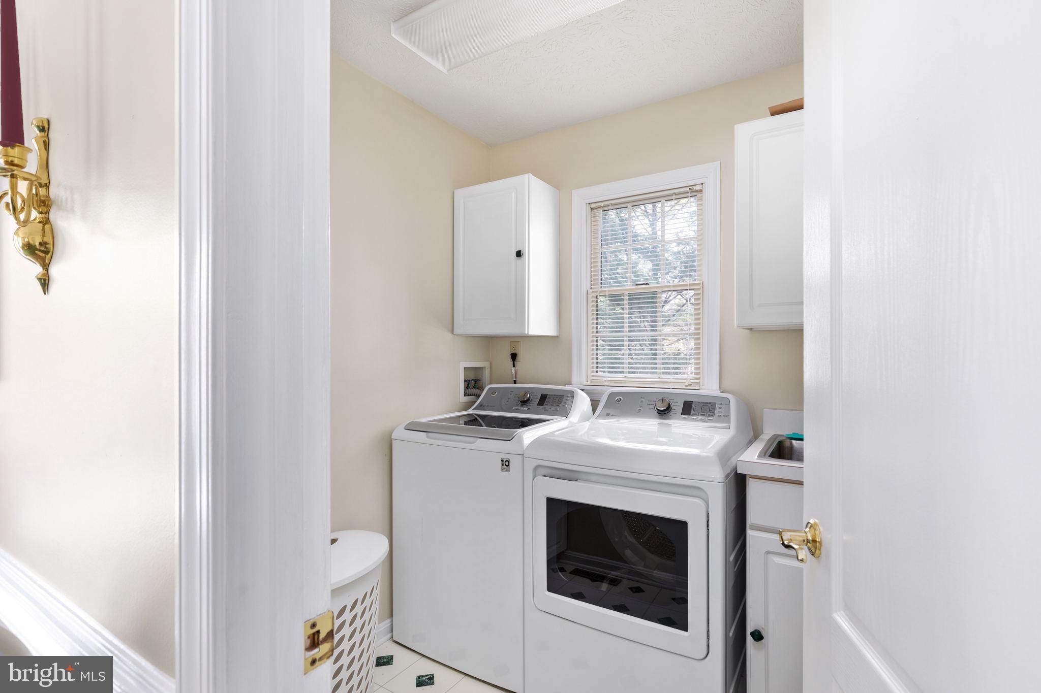 317 Anderson Road Basye, VA 22842 - Photo 15 of 51 a utility room with sink dryer and washer