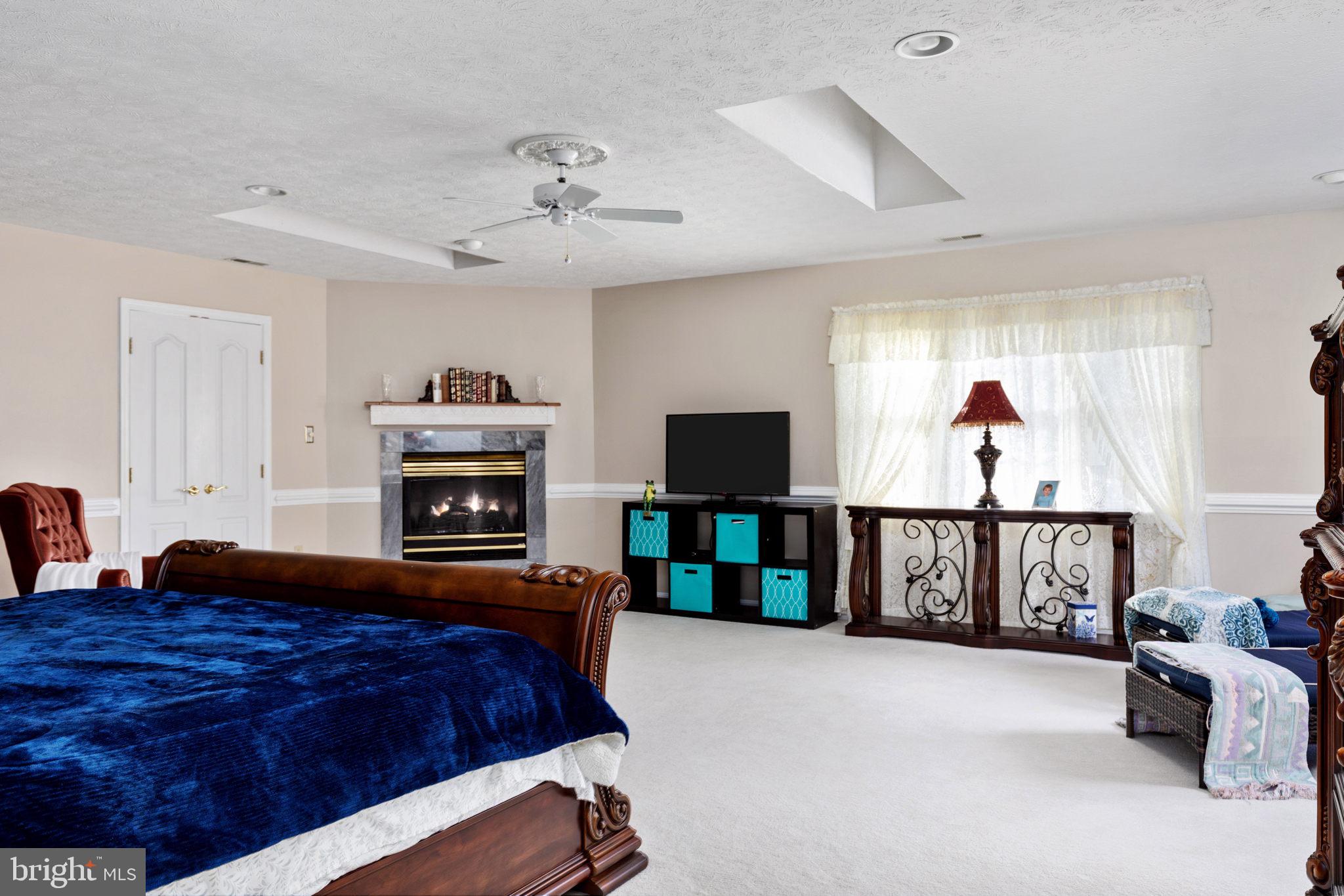 317 Anderson Road Basye, VA 22842 - Photo 21 of 51 a bedroom with a bed and a flat screen tv