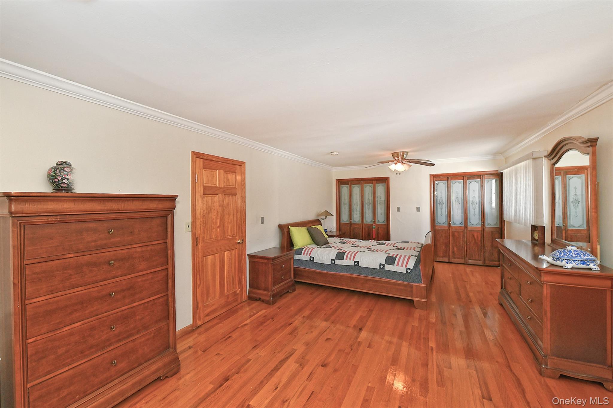 105 Roxton Road Plainview, NY 11803 - Photo 13 of 28 a living room with furniture and wooden floor