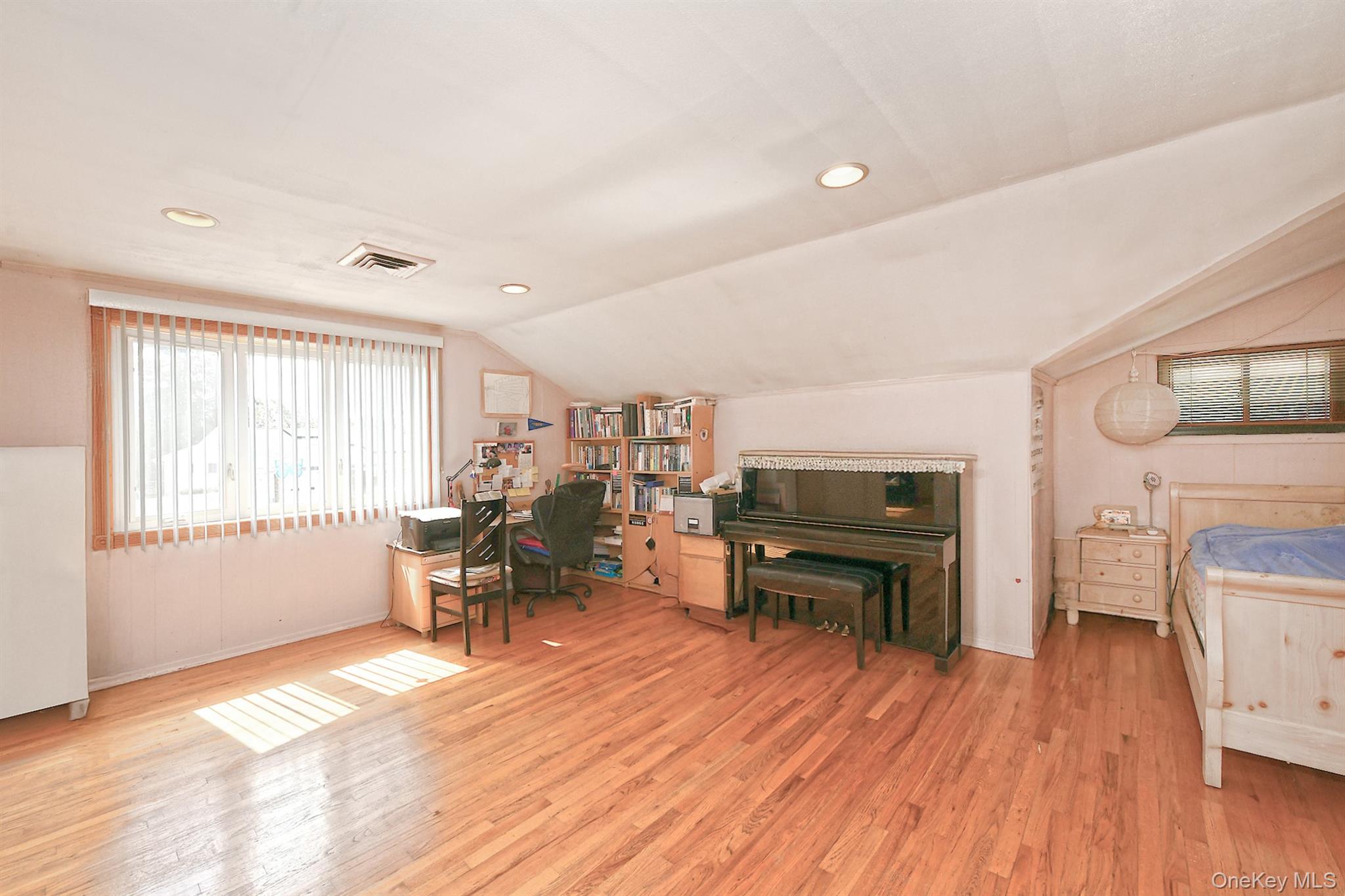 105 Roxton Road Plainview, NY 11803 - Photo 15 of 28 a living room with furniture and a wooden floor