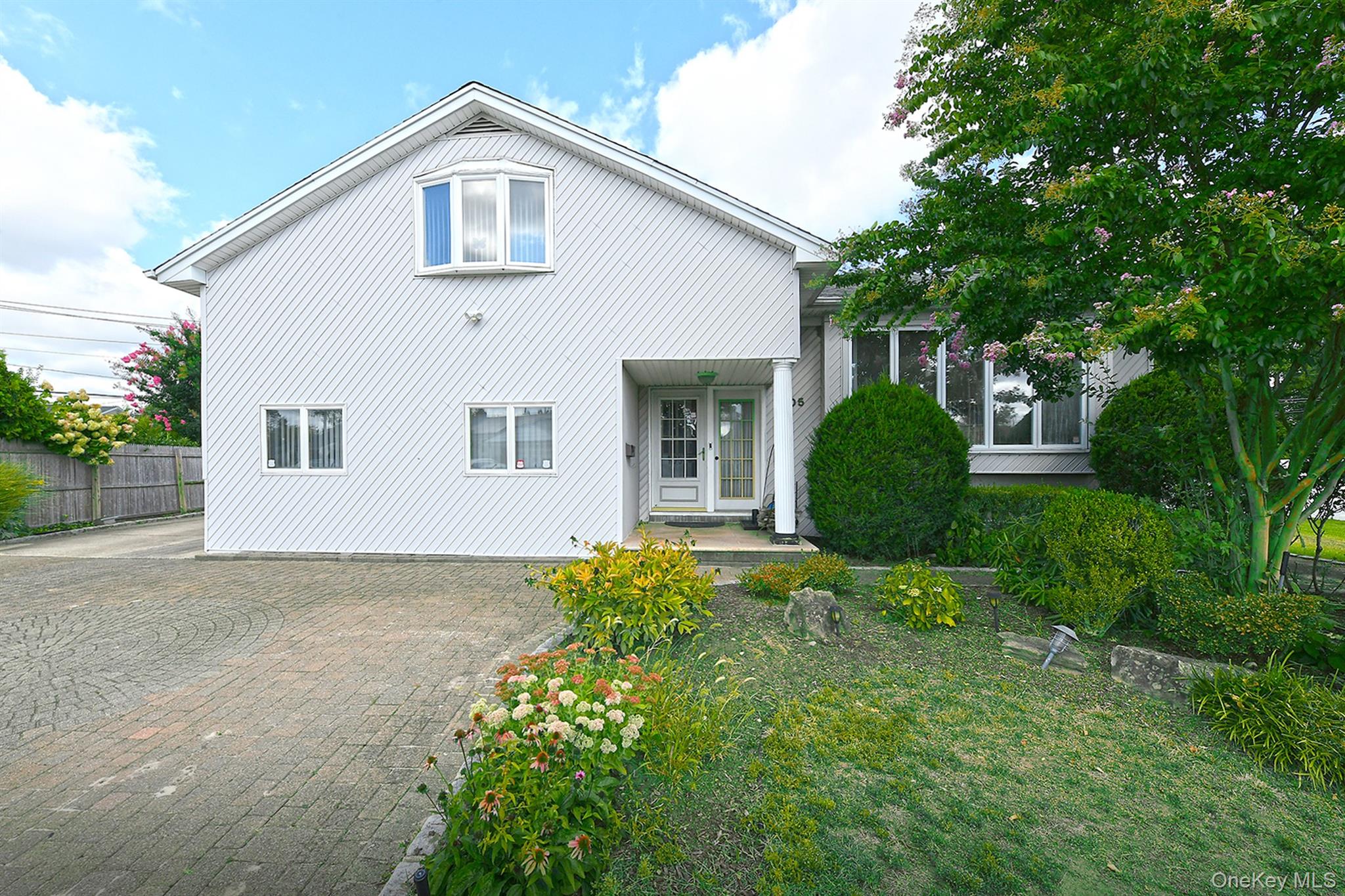105 Roxton Road Plainview, NY 11803 - Photo 2 of 28 a view of a house with a yard