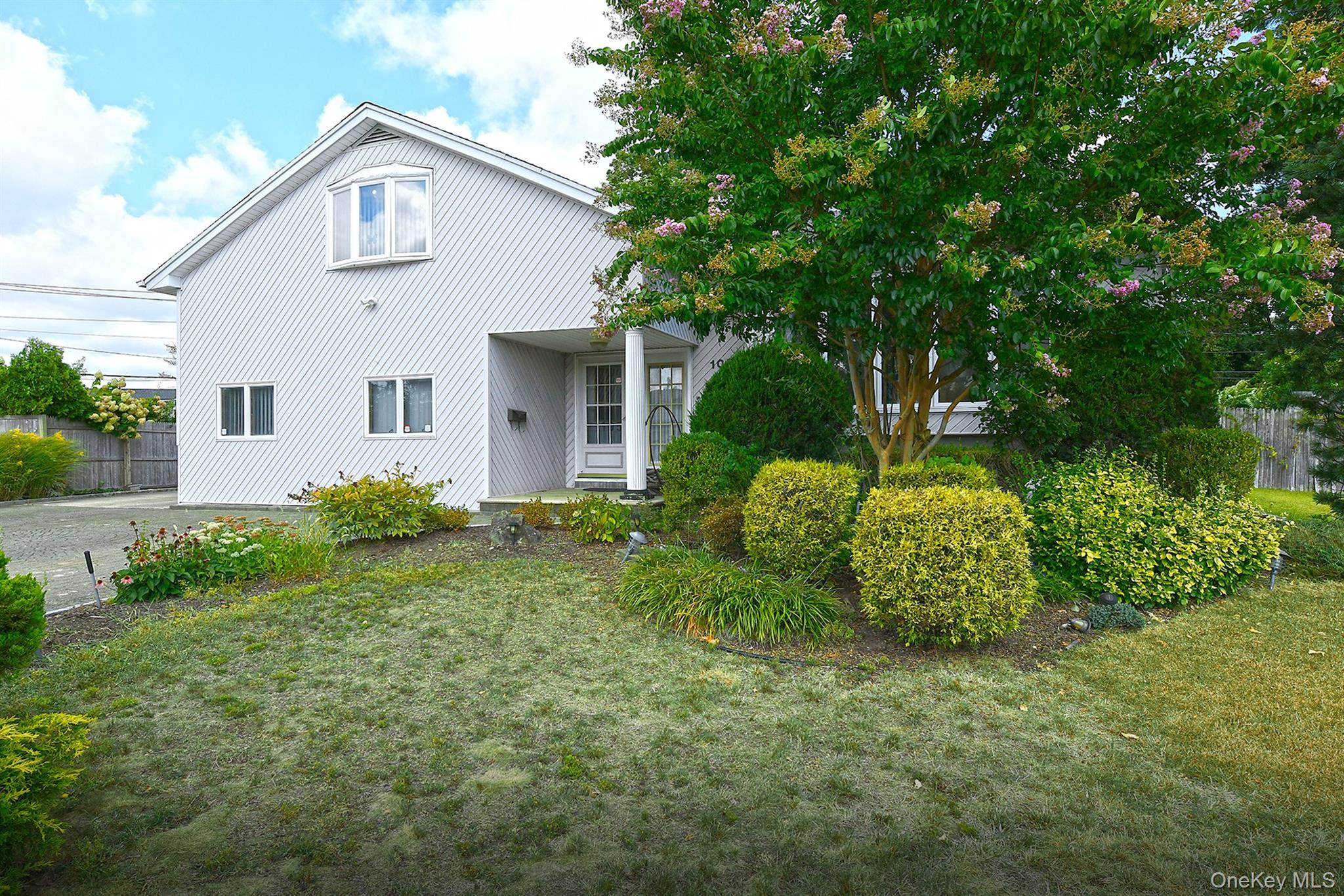 105 Roxton Road Plainview, NY 11803 - Photo 28 of 28 a view of a house with backyard and garden