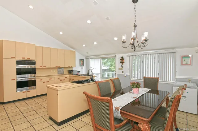 a view of a dining room with furniture window and outside view