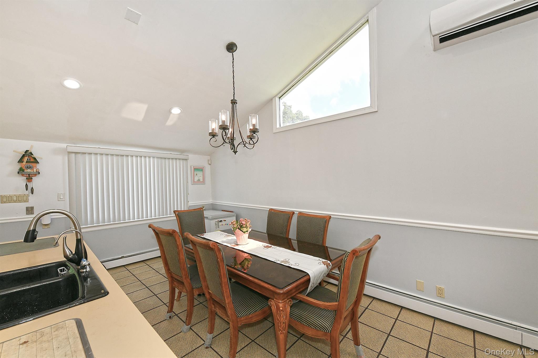 105 Roxton Road Plainview, NY 11803 - Photo 8 of 28 a view of a dining room with furniture and a window