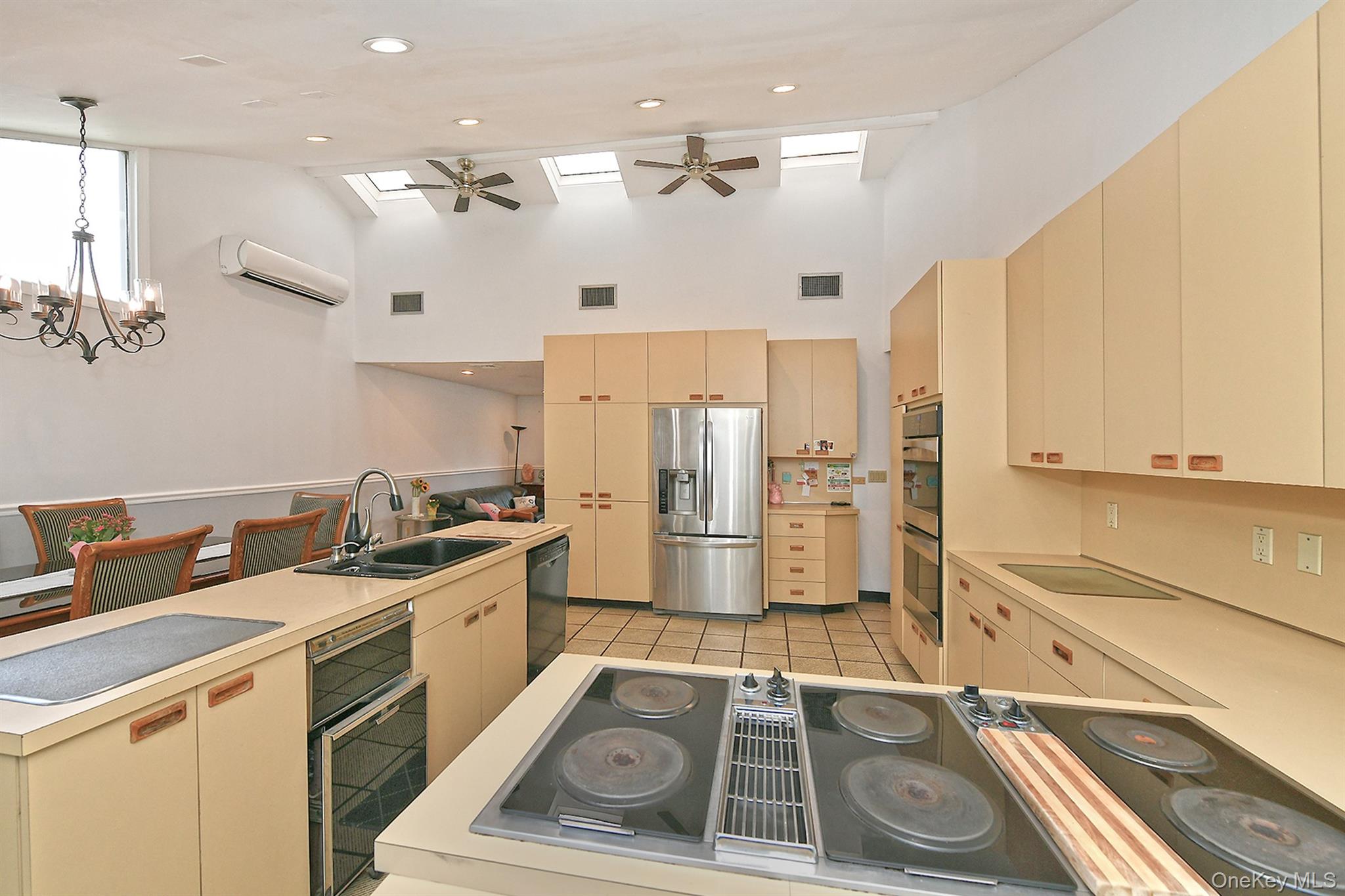 105 Roxton Road Plainview, NY 11803 - Photo 10 of 28 a kitchen with a sink stove and refrigerator