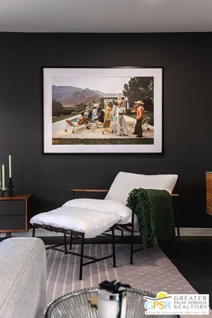 a bed sitting in a room next to a window