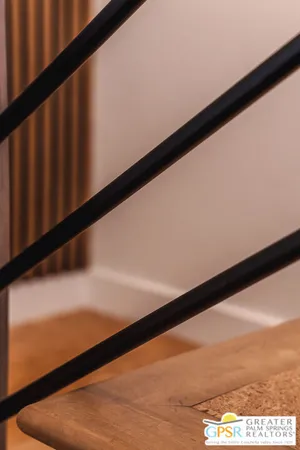 a hallway with wine glasses in a room