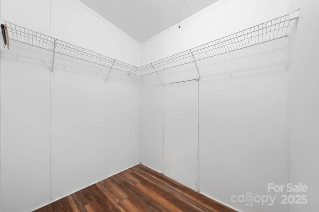 a view of a room with racks on the wall