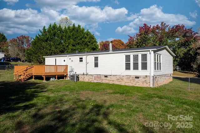 a view of a backyard with plants and a garden