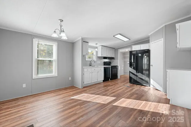 a view of a kitchen with a stove cabinets and wooden floor