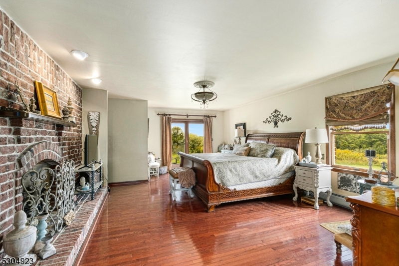 64 Mattison Road Branchville, NJ 07826 - Photo 15 of 40 a bedroom with a bed and wooden floor