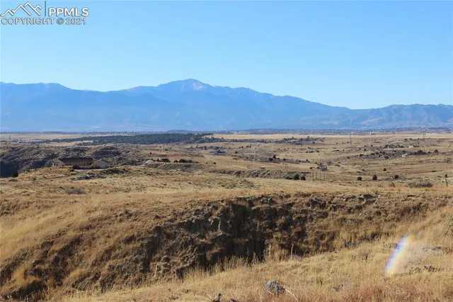 a view of an ocean and a mountain