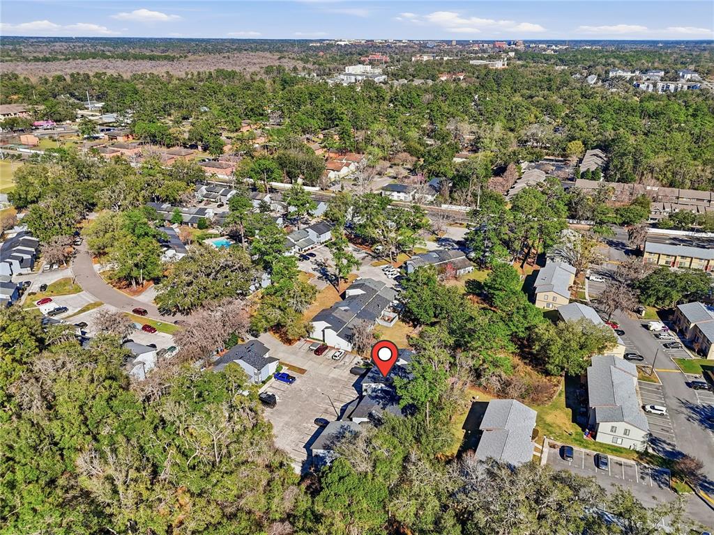 4427 Southwest 21st Lane Gainesville, FL 32607 - Photo 34 of 36 an aerial view of a houses with a yard