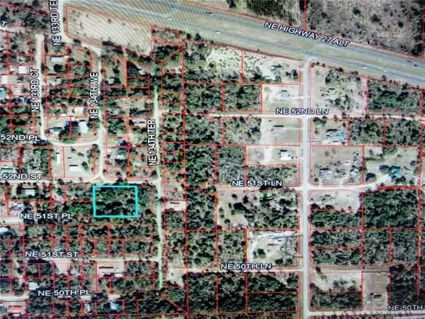 an aerial view of houses and roads