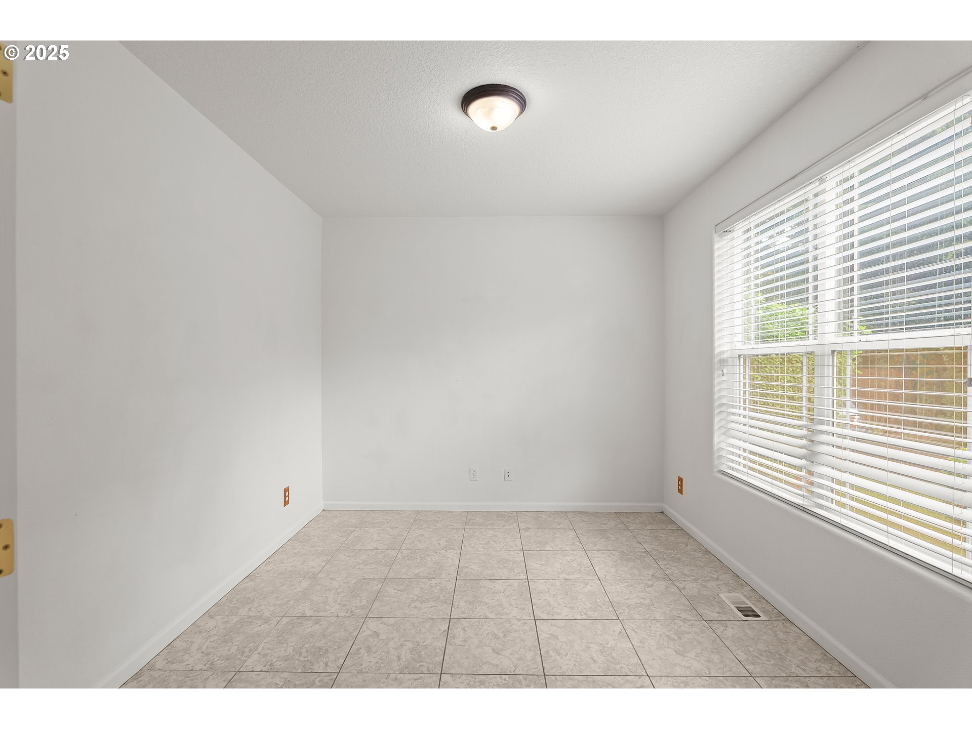 1971 Southwest 19th Terrace Gresham, OR 97080 - Photo 13 of 31 a view of an empty room with a window