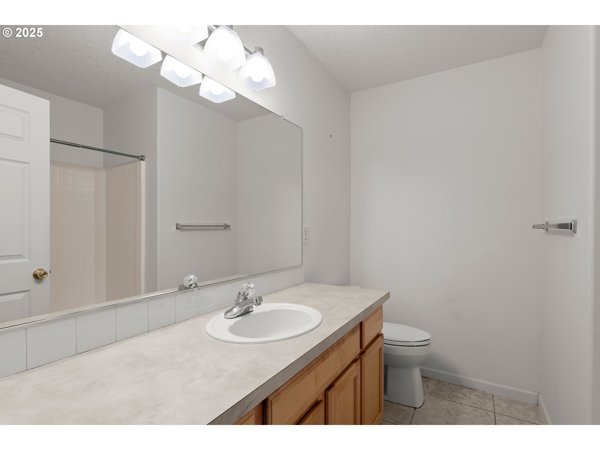 1971 Southwest 19th Terrace Gresham, OR 97080 - Photo 22 of 31 a bathroom with a sink vanity and a mirror