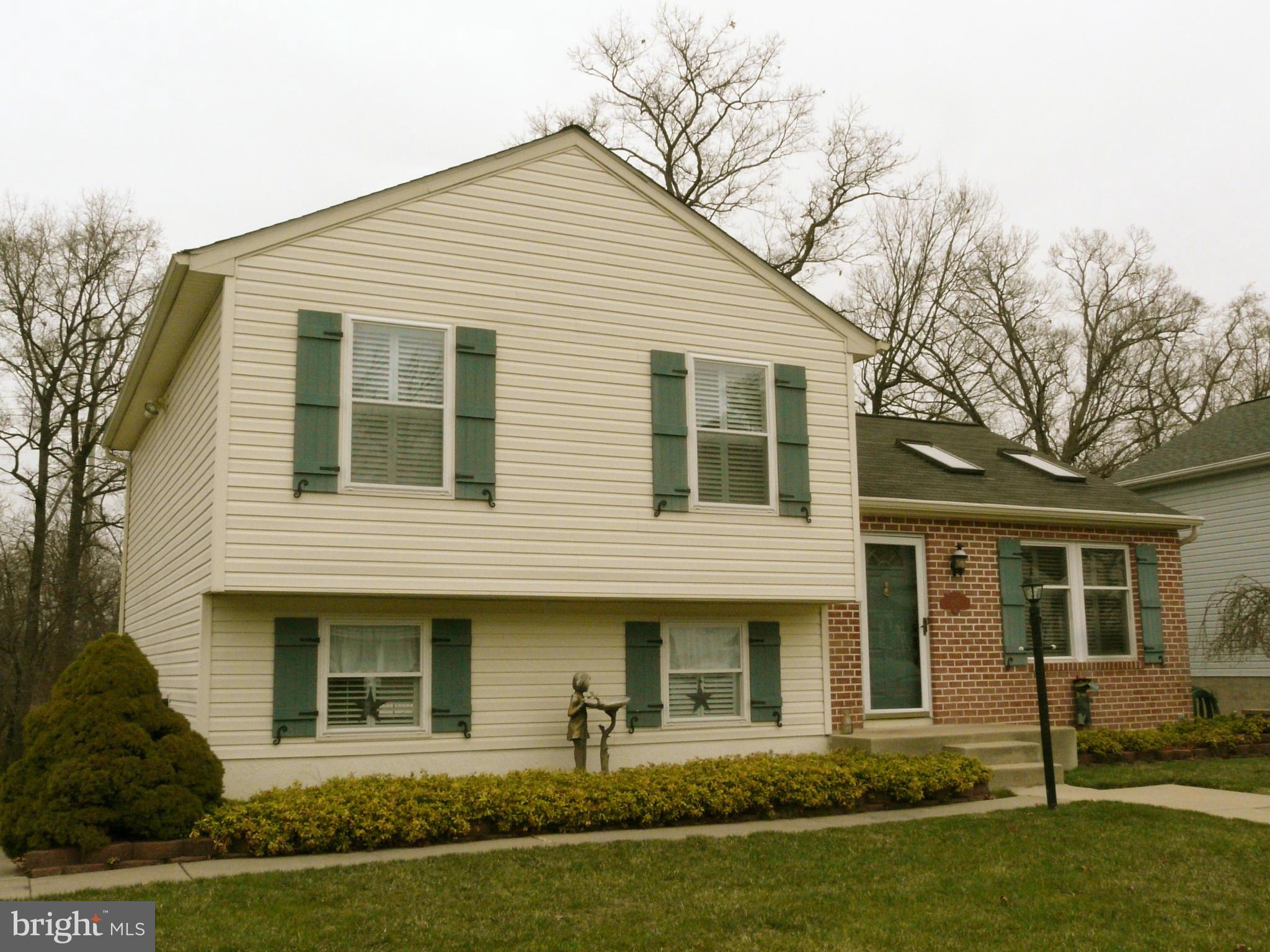 64 Yew Road Baltimore, MD 21221 - Photo 2 of 30 a front view of a house with a yard