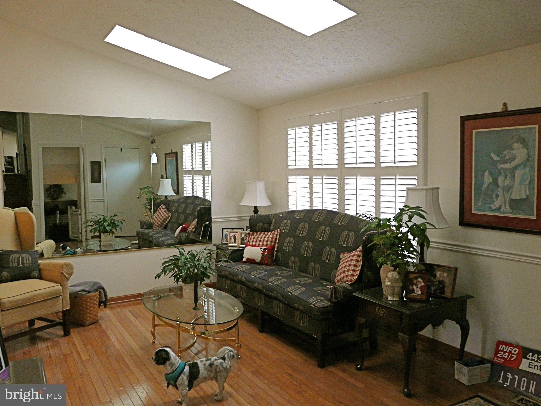 64 Yew Road Baltimore, MD 21221 - Photo 22 of 30 a living room with furniture and a potted plant