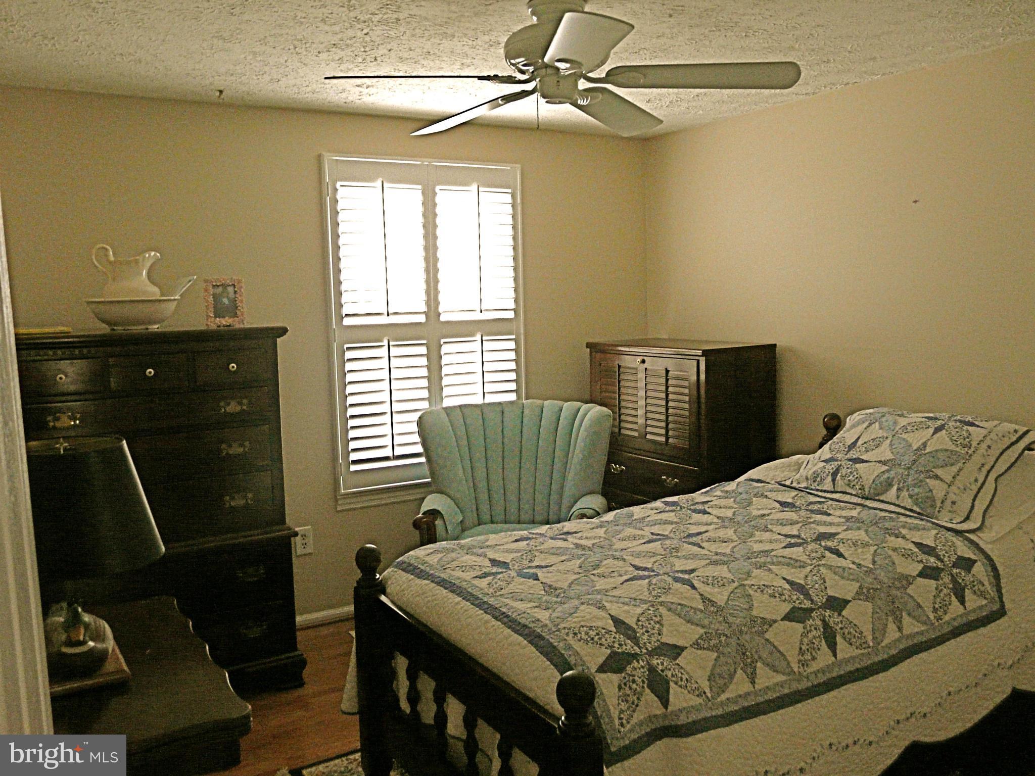 64 Yew Road Baltimore, MD 21221 - Photo 25 of 30 a bedroom with a bed and a window