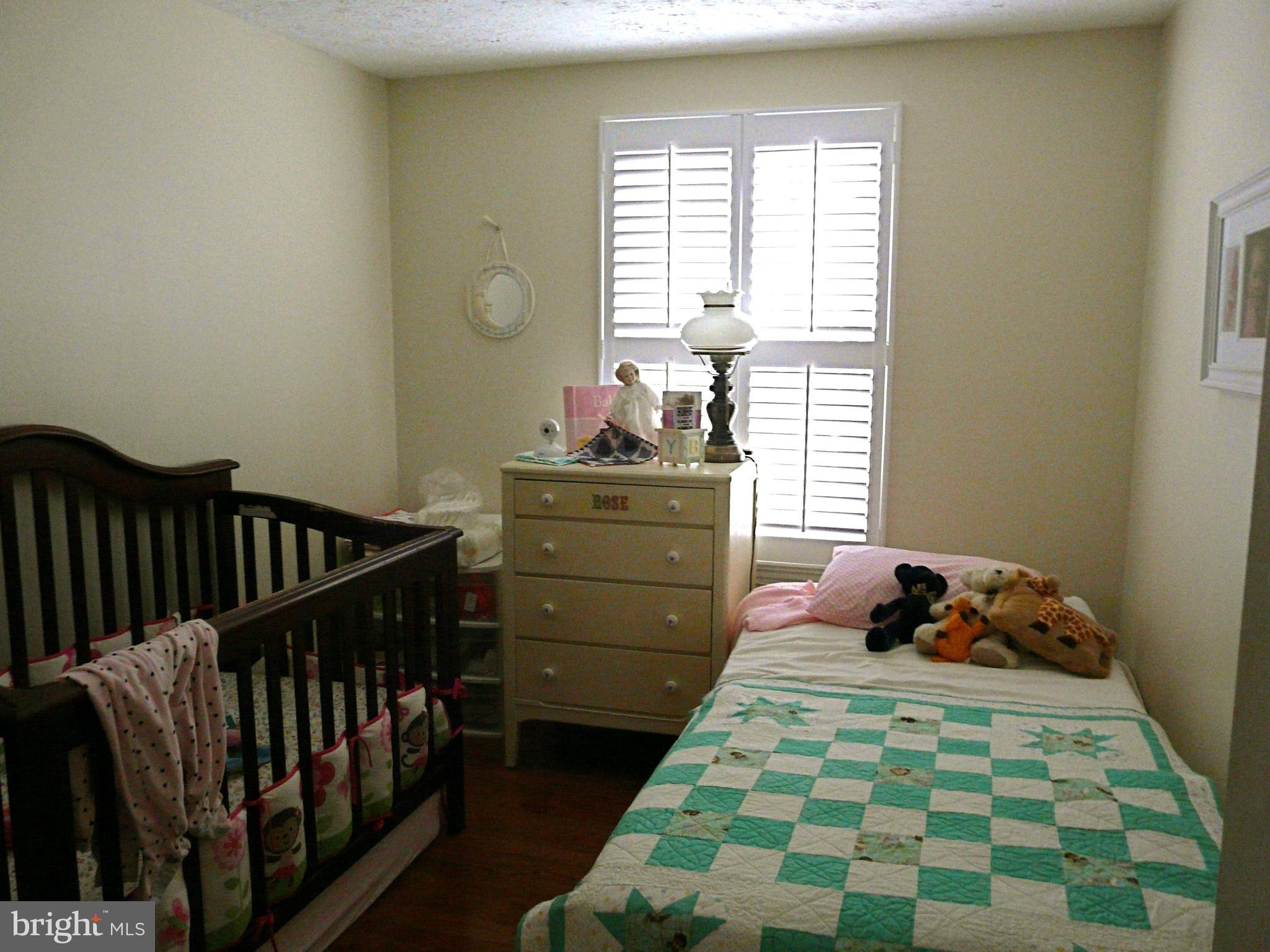 64 Yew Road Baltimore, MD 21221 - Photo 27 of 30 a bedroom with a bed and a window