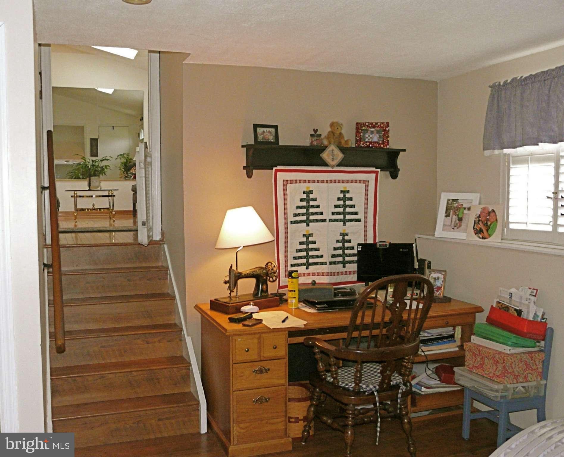 64 Yew Road Baltimore, MD 21221 - Photo 30 of 30 a view of a workspace with furniture and a window