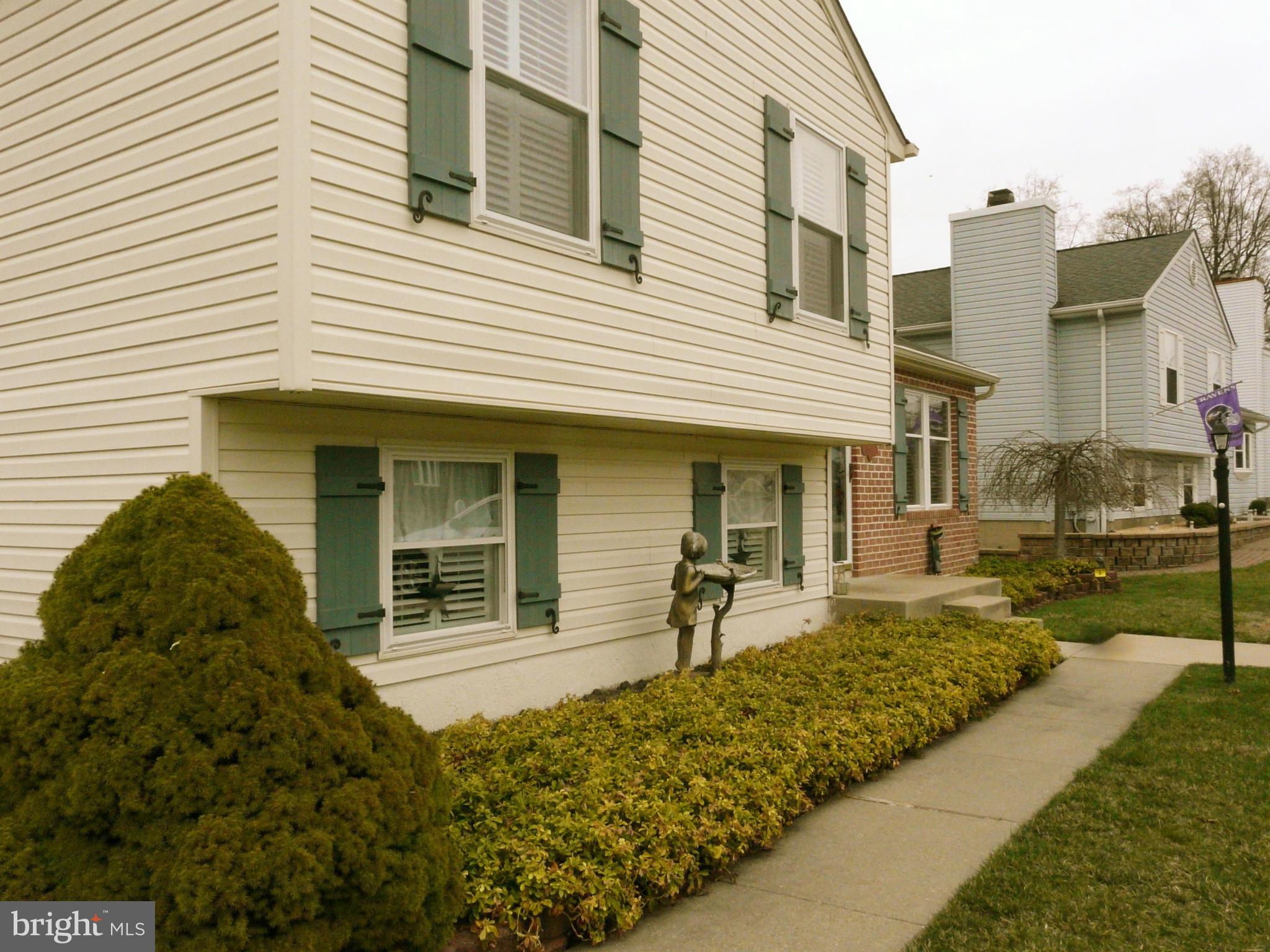 64 Yew Road Baltimore, MD 21221 - Photo 4 of 30 a front view of a house with a garden