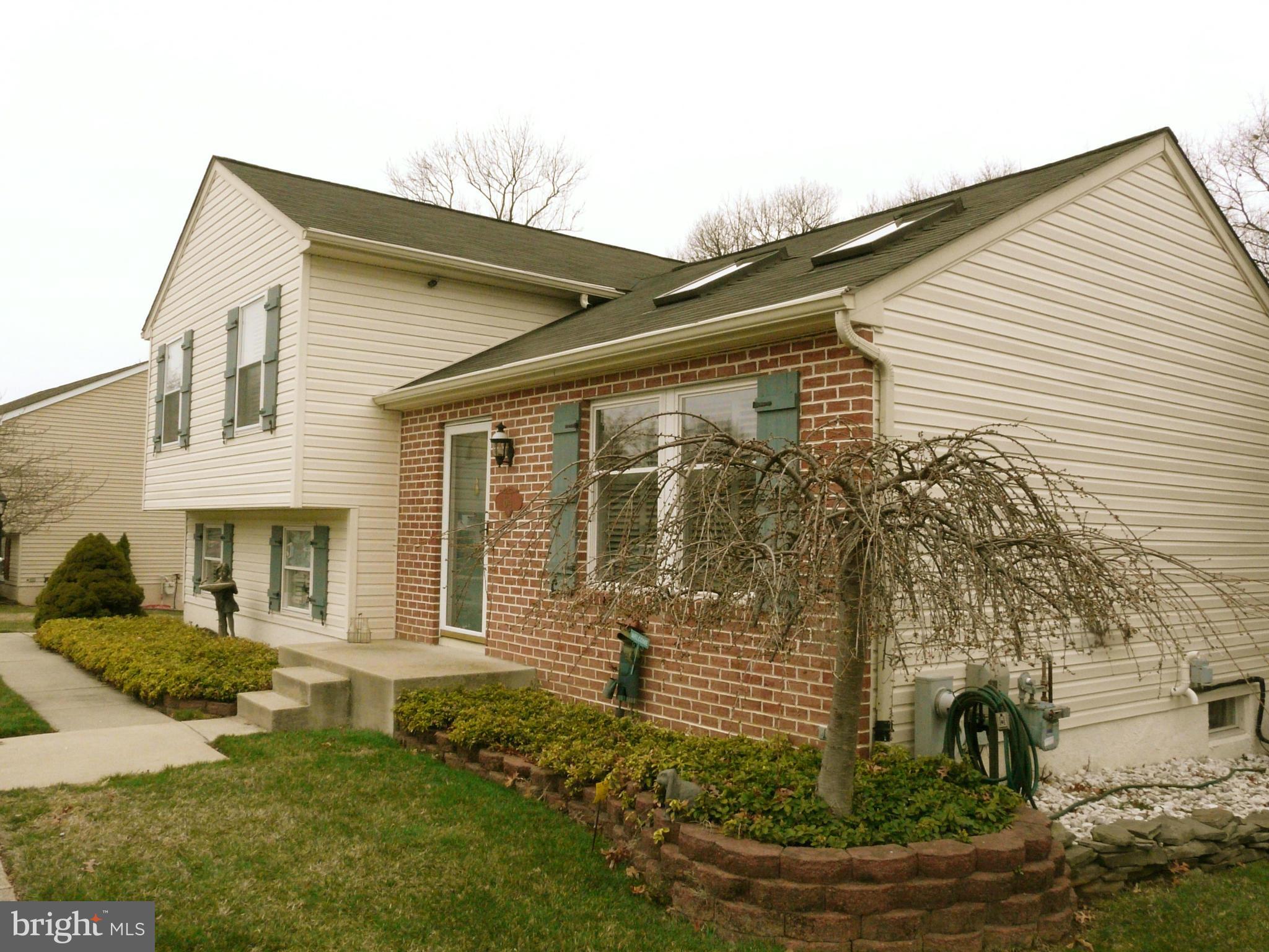 64 Yew Road Baltimore, MD 21221 - Photo 5 of 30 a front view of a house with a yard