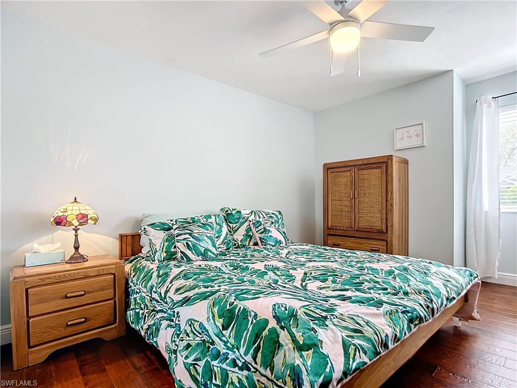 2860 Citrus Lake Drive, Unit R202 Naples, FL 34109 - Photo 27 of 50 a bedroom with a bed and a dresser