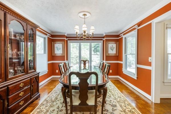167 Edgewater Drive Temple, GA 30179 - Photo 11 of 37 a dining room with furniture a chandelier and wooden floor