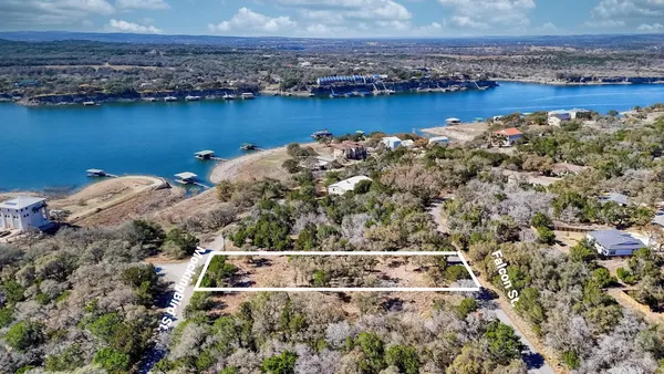 an aerial view of a house with a lake view