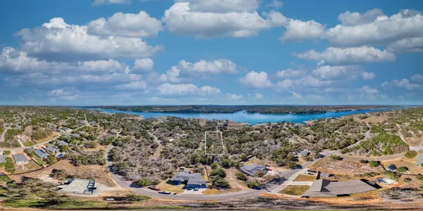 a view of a forest filled with trees