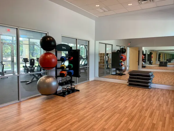 a room with wooden floor and furniture