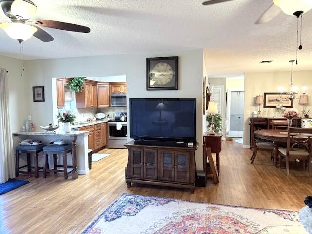 1206 South Lakes End Drive, Unit D Fort Pierce, FL 34982 - Photo 21 of 21 a living room with furniture and a flat screen tv