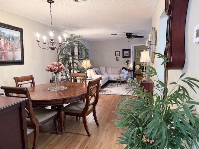 1206 South Lakes End Drive, Unit D Fort Pierce, FL 34982 - Photo 3 of 21 a view of a dining room with furniture and chandelier