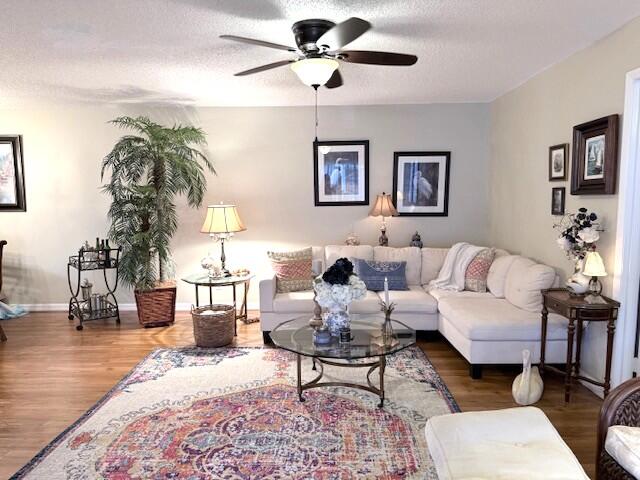 1206 South Lakes End Drive, Unit D Fort Pierce, FL 34982 - Photo 4 of 21 a living room with furniture and a lamp