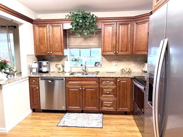1206 South Lakes End Drive, Unit D Fort Pierce, FL 34982 - Photo 5 of 21 a kitchen with a refrigerator sink and cabinets