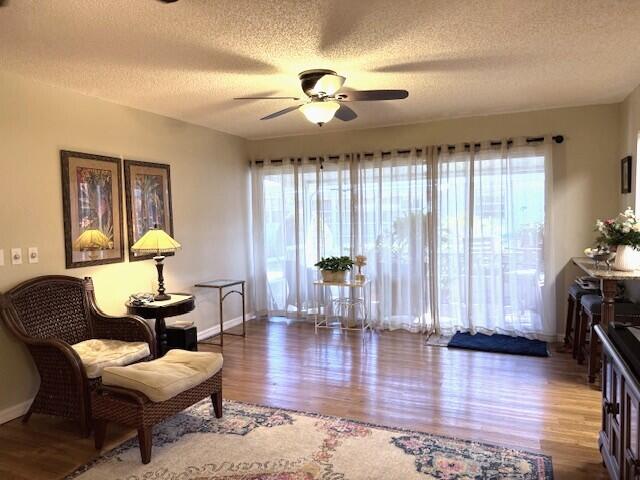 1206 South Lakes End Drive, Unit D Fort Pierce, FL 34982 - Photo 9 of 21 a room with furniture and wooden floor