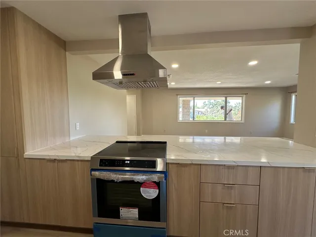 a kitchen with a stove and a sink
