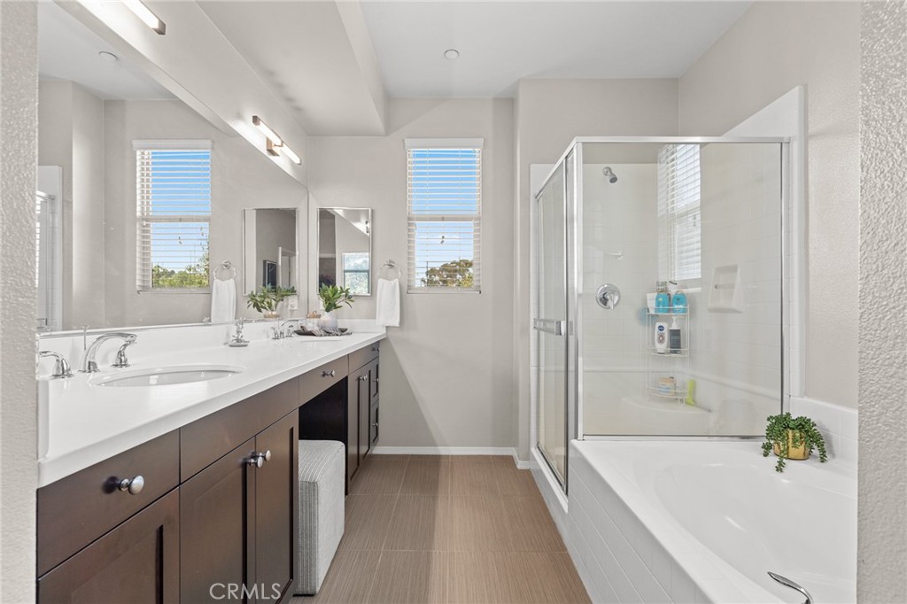 5321 Ocean, Unit 101 Hawthorne, CA 90250 - Photo 13 of 36 a bathroom with a granite countertop bathtub shower sink and mirror