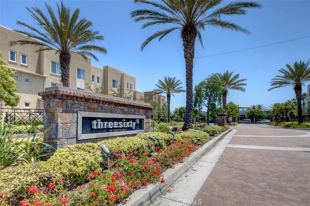 5321 Ocean, Unit 101 Hawthorne, CA 90250 - Photo 36 of 36 a sign board with flower plants and palm trees