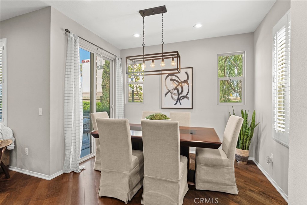 5321 Ocean, Unit 101 Hawthorne, CA 90250 - Photo 6 of 36 a view of a dining room with furniture window and wooden floor