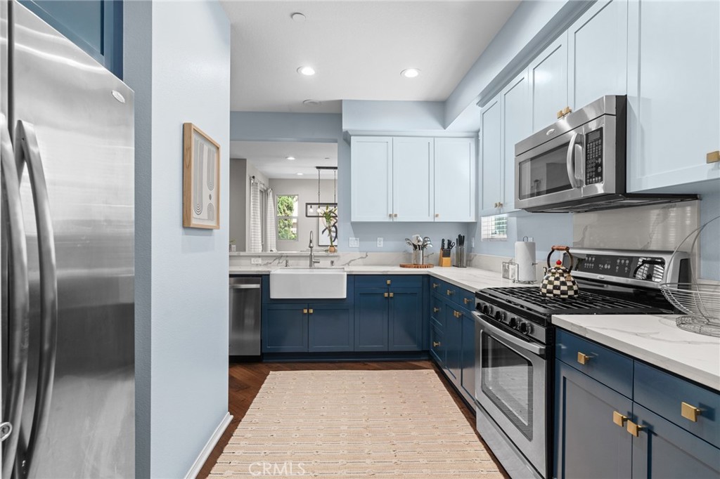 5321 Ocean, Unit 101 Hawthorne, CA 90250 - Photo 8 of 36 a kitchen with stainless steel appliances granite countertop a refrigerator a stove and a sink