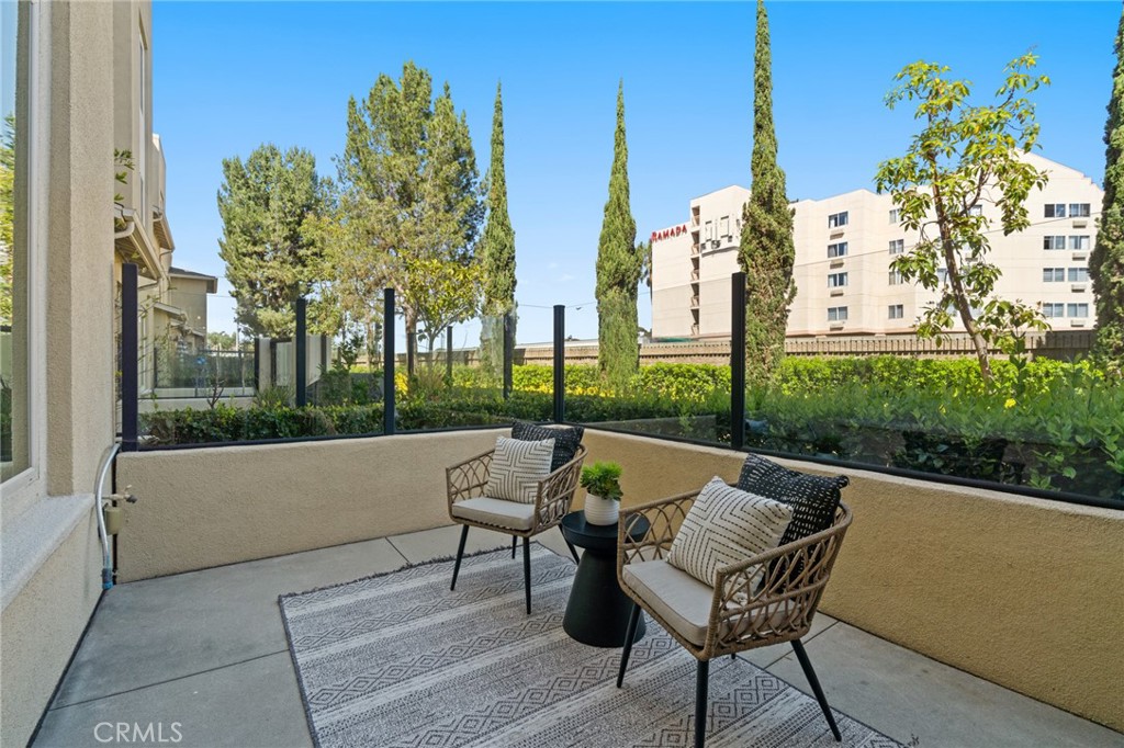 5321 Ocean, Unit 101 Hawthorne, CA 90250 - Photo 10 of 36 a view of a patio with table and chairs and potted plants