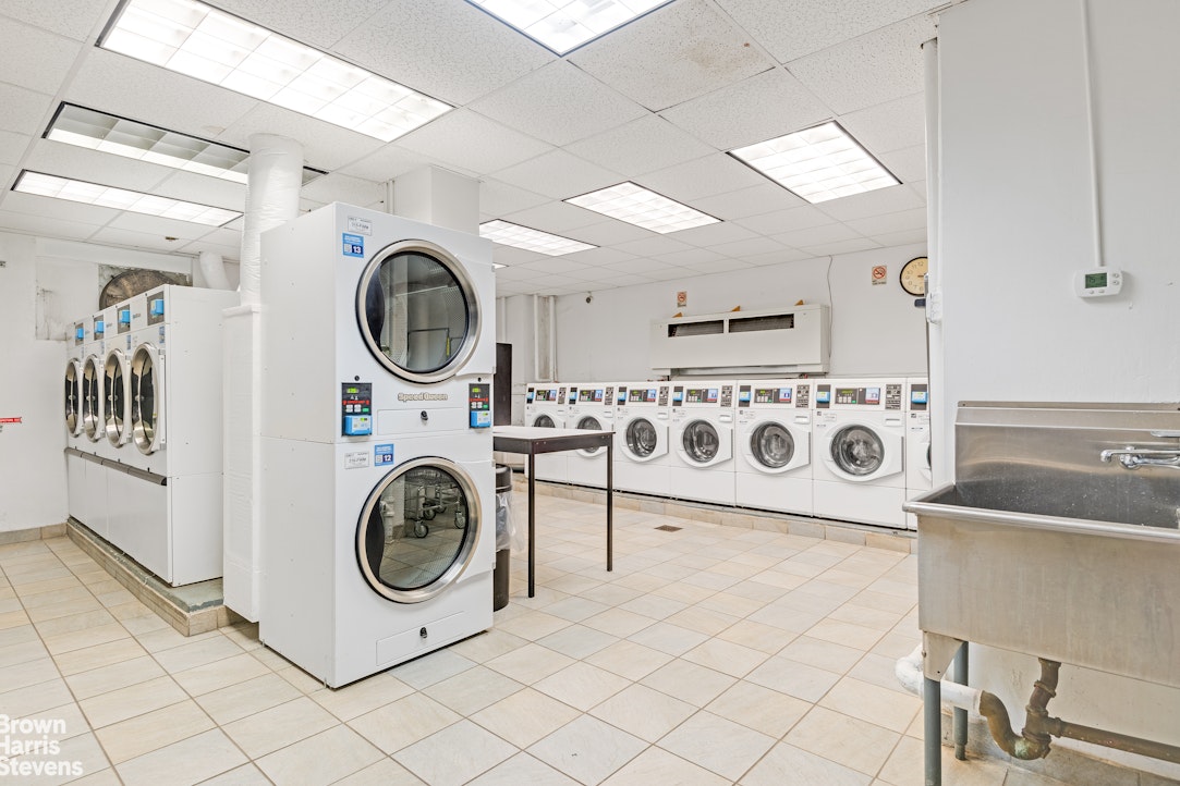 520 East 72nd Street, Unit 3G Manhattan, NY 10021 - Photo 10 of 15 a utility room with dryer and washer