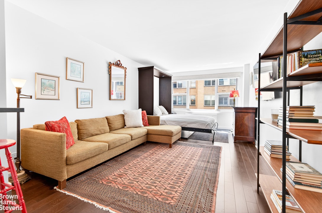 520 East 72nd Street, Unit 3G Manhattan, NY 10021 - Photo 2 of 15 a living room with furniture and a wooden floor
