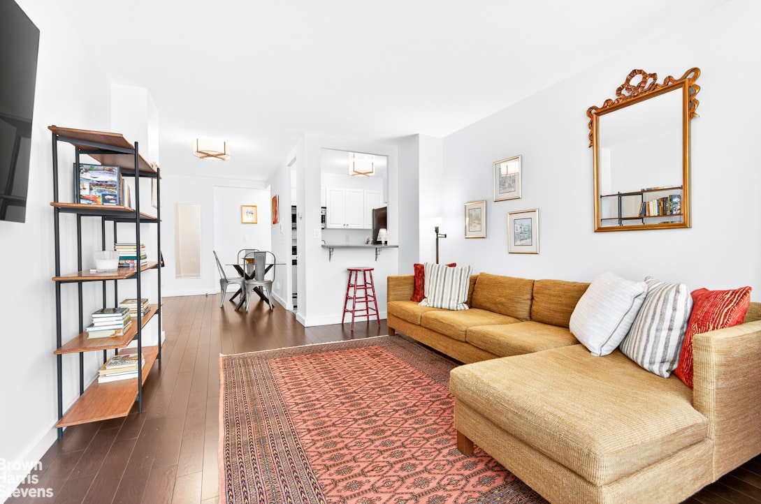 520 East 72nd Street, Unit 3G Manhattan, NY 10021 - Photo 3 of 15 a living room with furniture and wooden floor